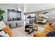 Open concept living room showcasing seamless flow into the kitchen, designed for modern living and effortless entertaining at 673 N Tempe St, Aurora, CO 80018