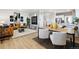 Spacious living area with modern decor, seamlessly flowing into an open-concept kitchen, perfect for entertaining guests at 673 N Tempe St, Aurora, CO 80018