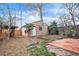 The backyard features garden beds and an exterior view of the garage at 3024 W Denver Pl, Denver, CO 80211