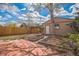 Spacious backyard featuring a patio, garden beds, shed and wooden fence at 3024 W Denver Pl, Denver, CO 80211