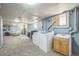 Basement includes laundry area, entertainment space, and room for multiple uses at 3024 W Denver Pl, Denver, CO 80211