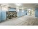 Finished basement with carpet, a stone fireplace, and windows for natural light at 3024 W Denver Pl, Denver, CO 80211