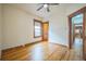 Bedroom featuring hardwood floors, window with wood trim, and doorways with wood trim at 3024 W Denver Pl, Denver, CO 80211