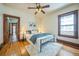A bedroom featuring hardwood floors and a metal bed frame at 3024 W Denver Pl, Denver, CO 80211