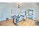A cozy dining room with chandelier lighting and hardwood floors at 3024 W Denver Pl, Denver, CO 80211