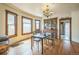Sunny dining room featuring hardwood floors, light fixture, built-in cabinet and natural wood trim at 3024 W Denver Pl, Denver, CO 80211