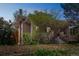 Brick home exterior with a landscaped front yard and mature trees at 3024 W Denver Pl, Denver, CO 80211