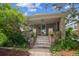 Home exterior featuring brick pillars, potted flowers, and the house number above the front door at 3024 W Denver Pl, Denver, CO 80211