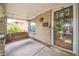 Inviting covered front porch with swing, brick accents, and mailbox near the glass front door at 3024 W Denver Pl, Denver, CO 80211