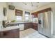 Kitchen featuring stainless steel appliances, white countertops, and lots of storage at 3024 W Denver Pl, Denver, CO 80211