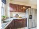 Kitchen featuring stainless steel appliances, white countertops, and lots of storage at 3024 W Denver Pl, Denver, CO 80211