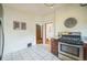 A kitchen with stainless steel oven and white tile flooring at 3024 W Denver Pl, Denver, CO 80211