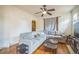 Comfortable living room featuring hardwood floors, a large sectional sofa and open to the dining room at 3024 W Denver Pl, Denver, CO 80211
