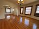 Inviting living room featuring gleaming hardwood floors, and large windows to let in natural light at 3024 W Denver Pl, Denver, CO 80211