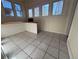 The mud room has tiled floors, and windows to let in lots of natural light at 3024 W Denver Pl, Denver, CO 80211