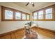 A sunny office with hardwood floors and ample natural lighting at 3024 W Denver Pl, Denver, CO 80211