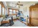 Office/bedroom with natural light, ceiling fan, hardwood floors and vintage wood trim at 3024 W Denver Pl, Denver, CO 80211
