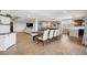 Finished basement with a dining area, kitchen, seating area, and game room at 5310 Craftsman Dr, Parker, CO 80134