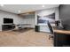 Spacious basement featuring a ping pong table and a home office setup with stylish wooden accents at 5310 Craftsman Dr, Parker, CO 80134