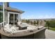 Inviting deck with comfortable seating around a fire pit and a stunning view of the landscape at 5310 Craftsman Dr, Parker, CO 80134