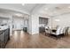 Open dining room with modern lighting, elegant décor, and an open floorplan at 5310 Craftsman Dr, Parker, CO 80134