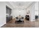 Elegant dining room featuring wood floors and modern decor at 5310 Craftsman Dr, Parker, CO 80134