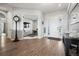 Charming entryway featuring wood floors and a view into an office at 5310 Craftsman Dr, Parker, CO 80134