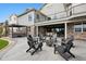 Back patio with fire pit and hot tub offers an ideal outdoor space for entertaining and relaxation at 5310 Craftsman Dr, Parker, CO 80134
