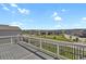 Scenic view from back deck overlooking a green space and neighboring homes at 5166 Trails Edge Ln, Castle Rock, CO 80104