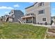 Backyard with a wooden deck, lawn and patio, perfect for outdoor enjoyment at 5166 Trails Edge Ln, Castle Rock, CO 80104