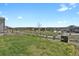 Lush green backyard with white fencing, providing a serene outdoor space at 5166 Trails Edge Ln, Castle Rock, CO 80104