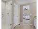 Bathroom featuring a glass-enclosed shower, tile flooring, and a view into the adjacent bedroom at 5166 Trails Edge Ln, Castle Rock, CO 80104