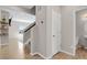 Welcoming entryway with hardwood floors and staircase to the upper level at 5166 Trails Edge Ln, Castle Rock, CO 80104