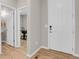Bright entryway with white doors and modern hardware, leading to office and powder room at 5166 Trails Edge Ln, Castle Rock, CO 80104
