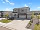 Charming two-story home with a covered porch, three-car garage, and well-maintained landscaping at 5166 Trails Edge Ln, Castle Rock, CO 80104