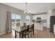 Bright kitchen with a view to the dining room and exterior deck at 5166 Trails Edge Ln, Castle Rock, CO 80104