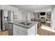 Modern kitchen with stainless steel appliances, granite countertops, and an island with a sink at 5166 Trails Edge Ln, Castle Rock, CO 80104