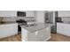 Gourmet kitchen with stainless steel appliances, an island, and granite countertops at 5166 Trails Edge Ln, Castle Rock, CO 80104