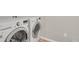 Well-lit laundry room featuring a modern, white LG washer and dryer set at 5166 Trails Edge Ln, Castle Rock, CO 80104