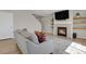 Cozy living room featuring a fireplace and floating shelves at 5166 Trails Edge Ln, Castle Rock, CO 80104