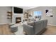 Comfortable living room featuring a cozy fireplace, floating shelves, and neutral decor with plush seating at 5166 Trails Edge Ln, Castle Rock, CO 80104