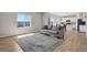 Open-concept living room with ample natural light and seamless flow to the kitchen at 5166 Trails Edge Ln, Castle Rock, CO 80104