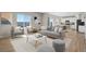 Bright living room with stylish gray furniture, modern decor, and large windows offering natural light at 5166 Trails Edge Ln, Castle Rock, CO 80104