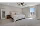 Spacious main bedroom featuring a large window, ceiling fan and neutral color scheme at 5166 Trails Edge Ln, Castle Rock, CO 80104