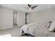 Large main bedroom with neutral colors and an ensuite bathroom at 5166 Trails Edge Ln, Castle Rock, CO 80104