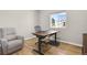 Home office featuring a modern adjustable desk and a comfortable recliner at 5166 Trails Edge Ln, Castle Rock, CO 80104