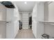 Spacious walk-in closet with custom shelving and hanging rods for optimal organization and storage at 5166 Trails Edge Ln, Castle Rock, CO 80104