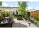 Outdoor patio with seating area and cozy fire pit at 3617 Shoshone St, Denver, CO 80211