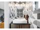 Chic bathroom featuring a unique patterned wall and modern sink at 3617 Shoshone St, Denver, CO 80211