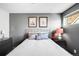 Serene bedroom features a comfortable bed, modern lighting, and stylish decor for a relaxing ambiance at 3617 Shoshone St, Denver, CO 80211